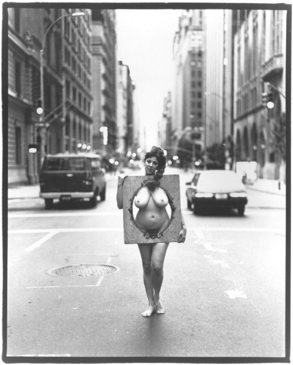 Annie Sprinkle - standing in the middle of the street in the nude.